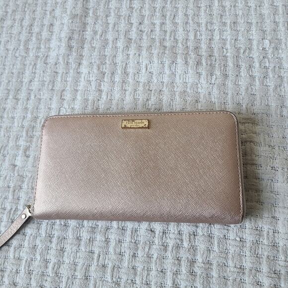 kate spade Handbags - Kate Spade New York Rose Gold Leather Zip Around Wallet